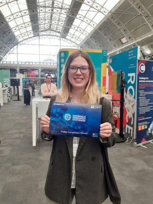 Ksenia receives the Best Poster Award at the MRE Exchange conference in London, 2024